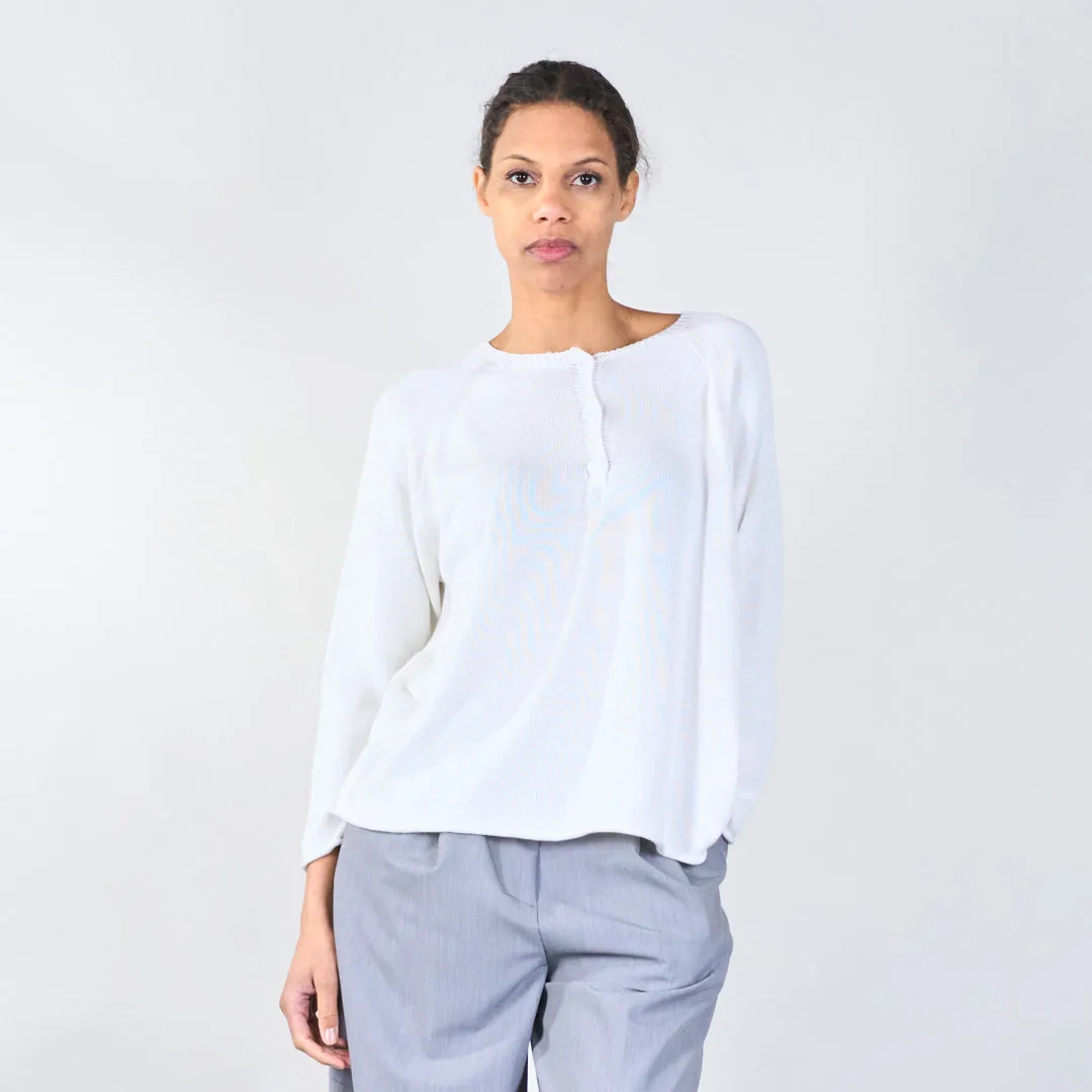 Knit top with button detail and wavy hem wholesale