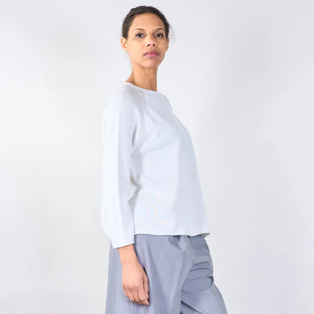 Knit top with button detail and wavy hem wholesale