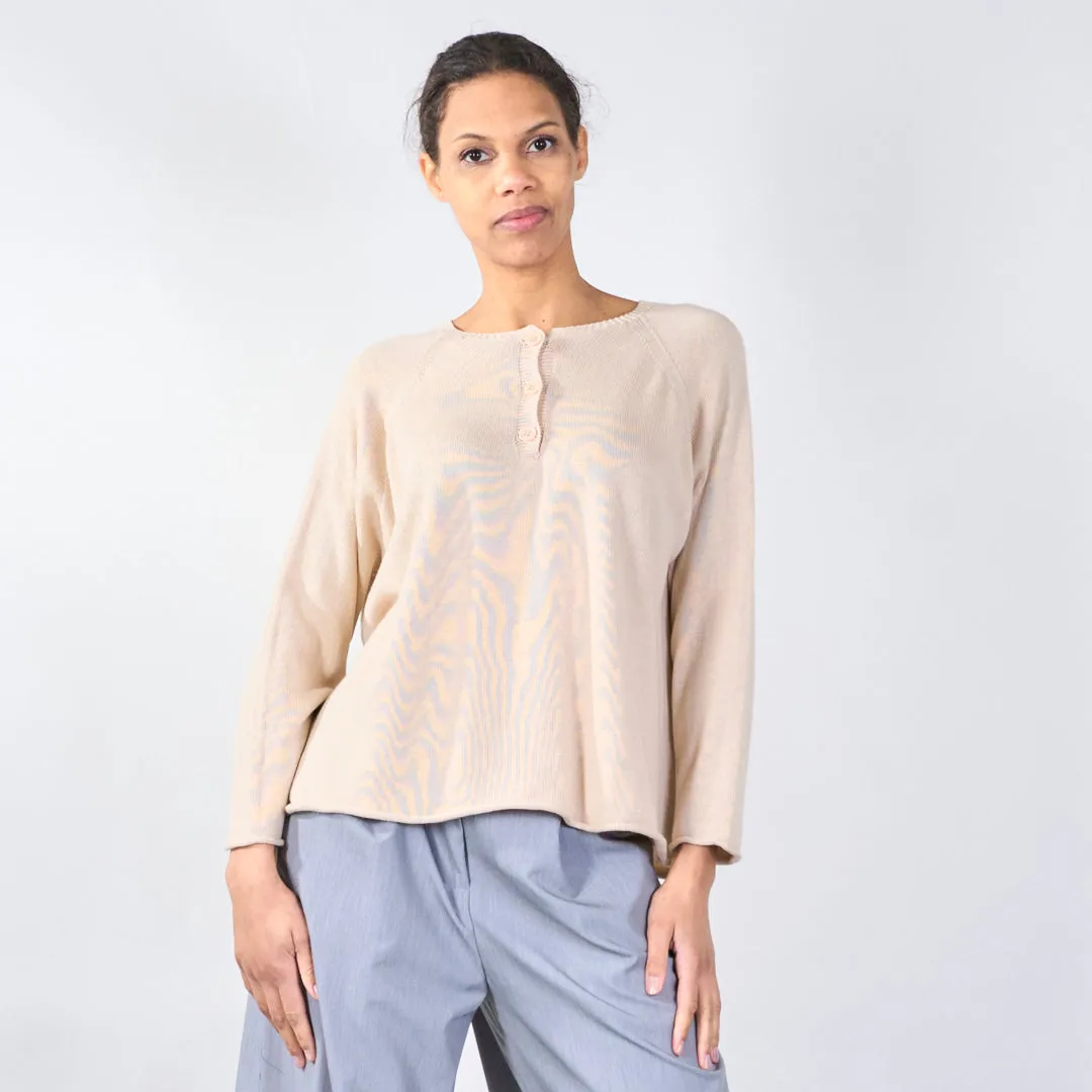 Knit top with button detail and wavy hem wholesale
