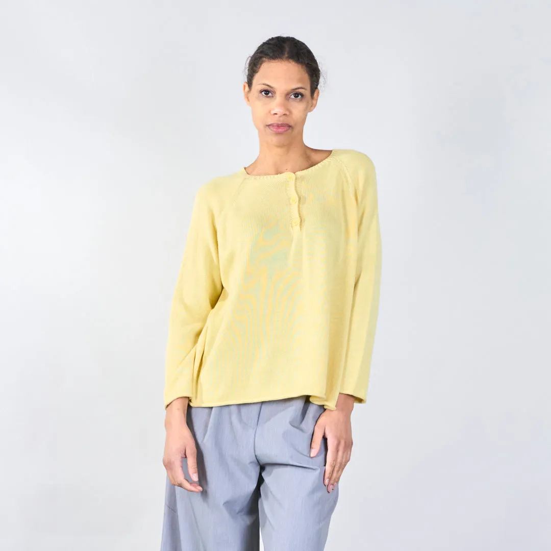 Knit top with button detail and wavy hem wholesale