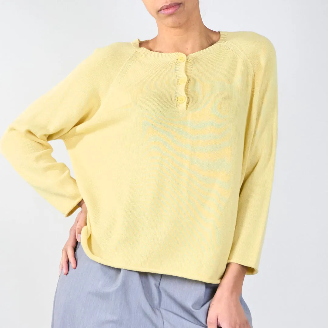 Knit top with button detail and wavy hem wholesale