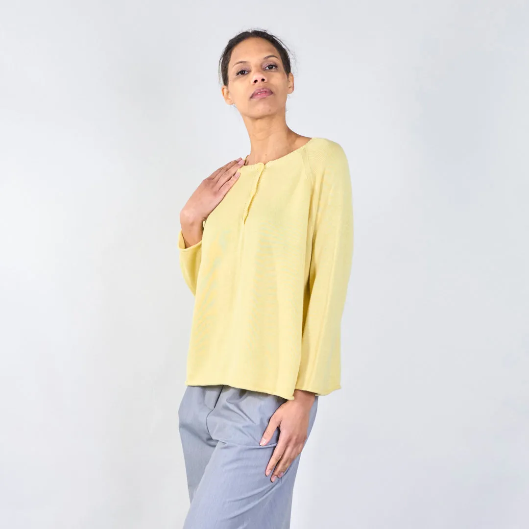 Knit top with button detail and wavy hem wholesale