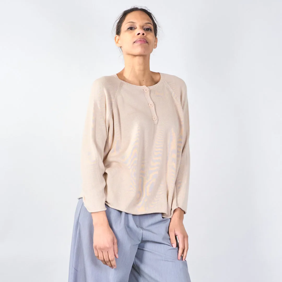 Knit top with button detail and wavy hem wholesale