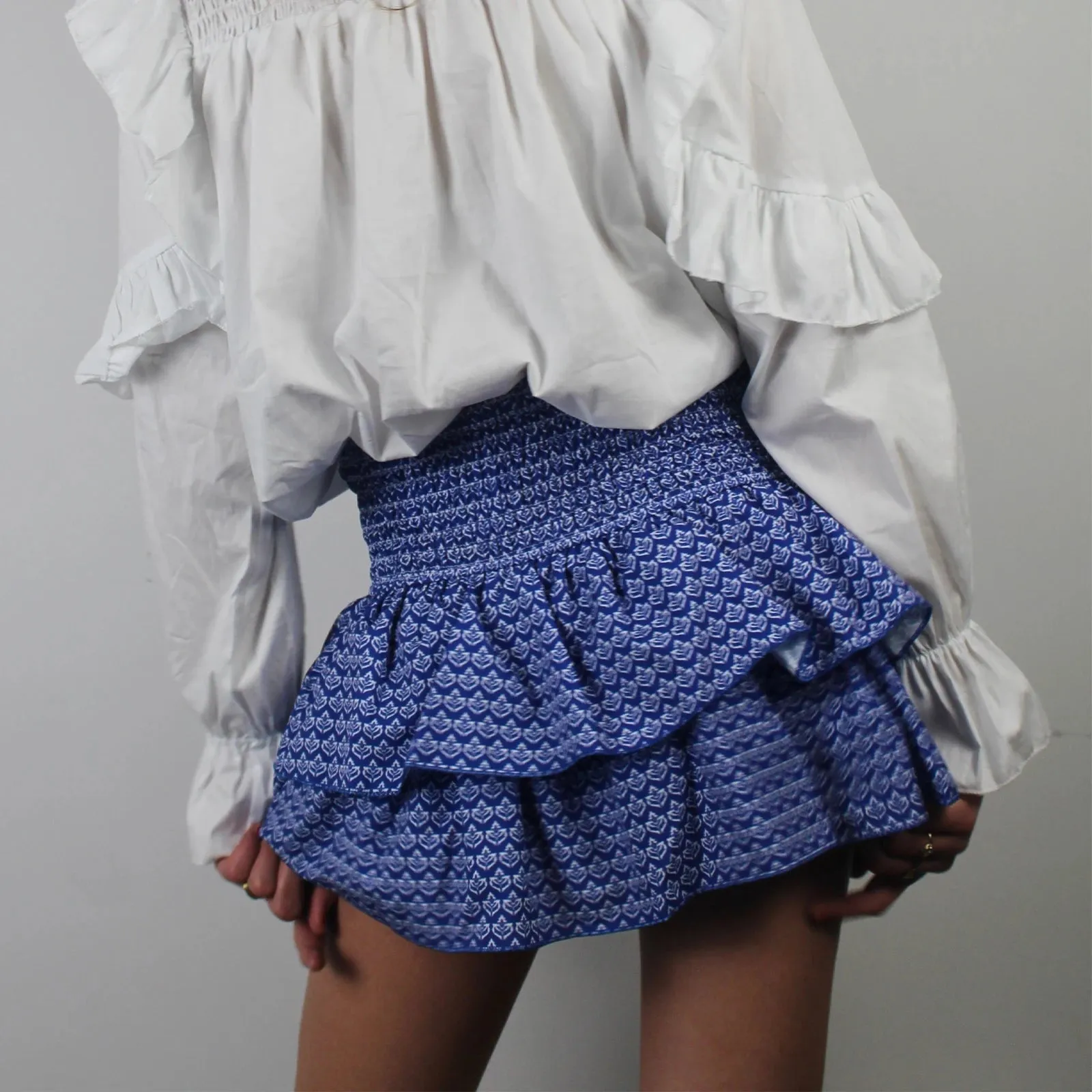 Sunloudy Women's Smocked Ruffle Hem Mini Skirt High Waist Flared Pleated Skater Skirt for Playful Elegance